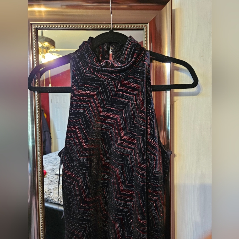 NWOT gorgeous black gown with sparkly red graphic lines throughout.